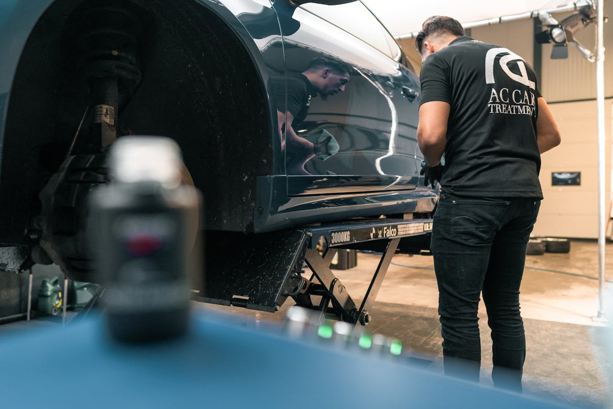 A Man Repairing a Car