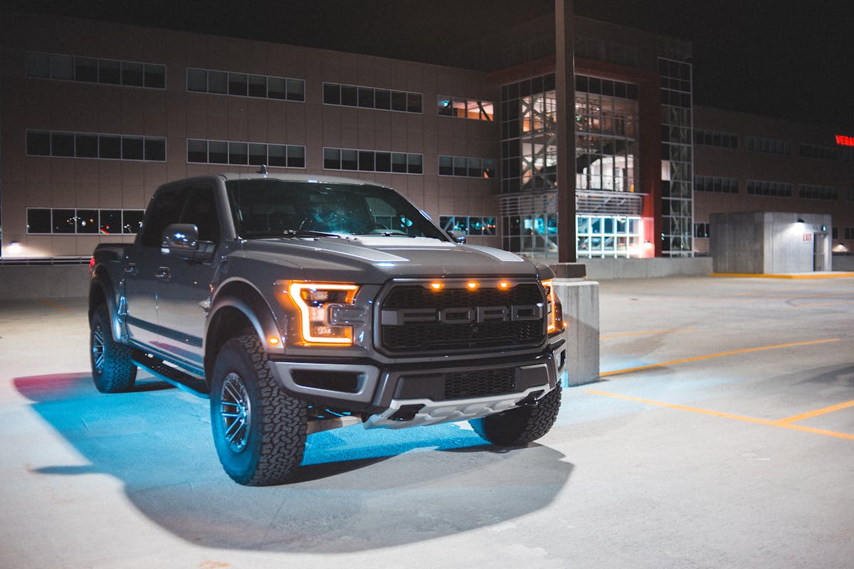 Pickup truck with neon light parked on street